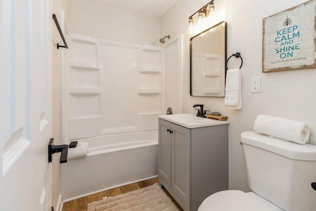 3901 Lawnwoods Dr, Des Moines, IA 50310 - full bathroom with wood finished floors, vanity, and shower / bath combination
