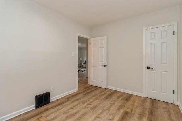 3901 Lawnwoods Dr, Des Moines, IA 50310 - unfurnished bedroom featuring light wood finished floors and baseboards