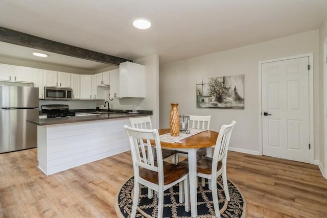 3901 Lawnwoods Dr, Des Moines, IA 50310 - dining space with beamed ceiling, light wood-style floors, and recessed lighting