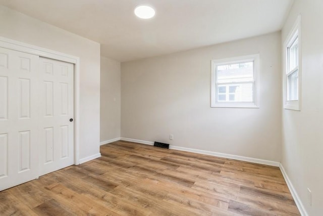 3901 Lawnwoods Dr, Des Moines, IA 50310 - unfurnished bedroom featuring light wood-style floors and a closet