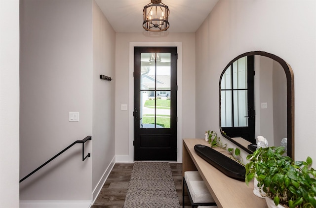 16320 Northpark Dr, Urbandale, IA 50323 - doorway with a chandelier and dark wood finished floors