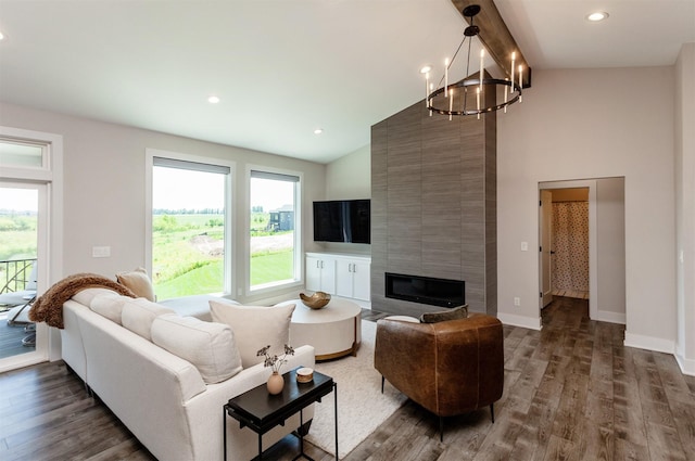 16320 Northpark Dr, Urbandale, IA 50323 - living area with a chandelier, wood finished floors, beamed ceiling, a tile fireplace, and recessed lighting