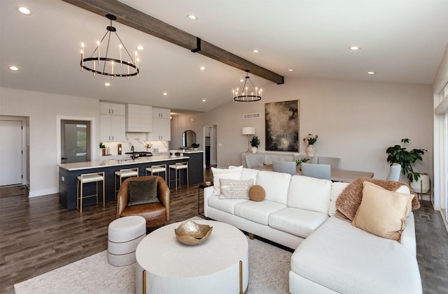 16320 Northpark Dr, Urbandale, IA 50323 - living room featuring a chandelier, dark wood-style floors, and recessed lighting