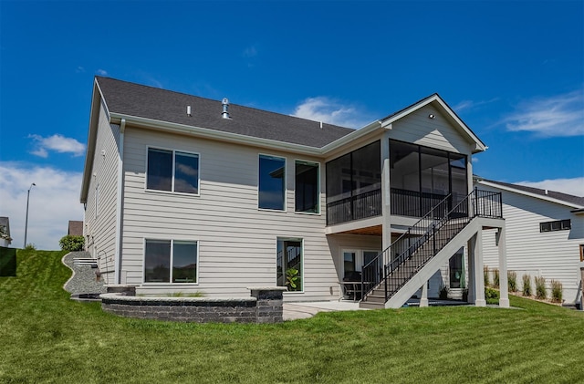 16320 Northpark Dr, Urbandale, IA 50323 - rear view of house featuring a patio, a sunroom, a lawn, and stairs
