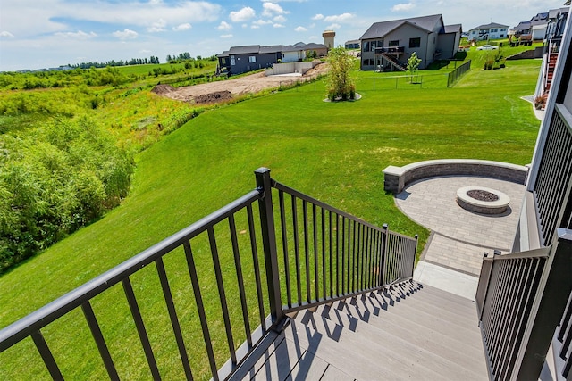 16320 Northpark Dr, Urbandale, IA 50323 - wooden deck with a fire pit, a residential view, and a yard