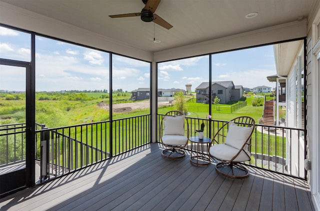 16320 Northpark Dr, Urbandale, IA 50323 - unfurnished sunroom with ceiling fan, healthy amount of natural light, and a residential view