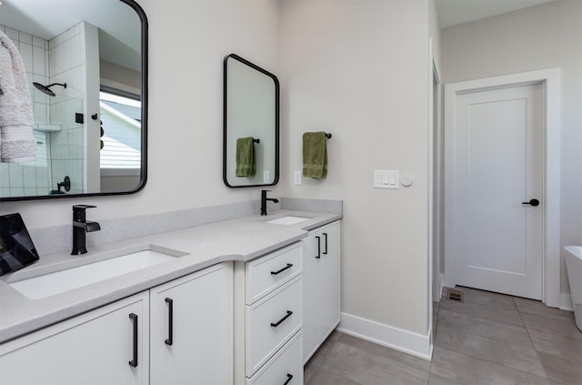 16320 Northpark Dr, Urbandale, IA 50323 - full bath with double vanity, a tile shower, and a freestanding bath