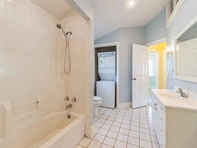 780 Iowa Ave, Martensdale, IA 50160 - full bathroom with stacked washer / dryer, tile patterned floors, shower / bath combination, vanity, and vaulted ceiling