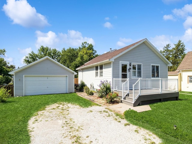 780 Iowa Ave, Martensdale, IA 50160 - ranch-style house with a garage, an outdoor structure, a front yard, and a wooden deck