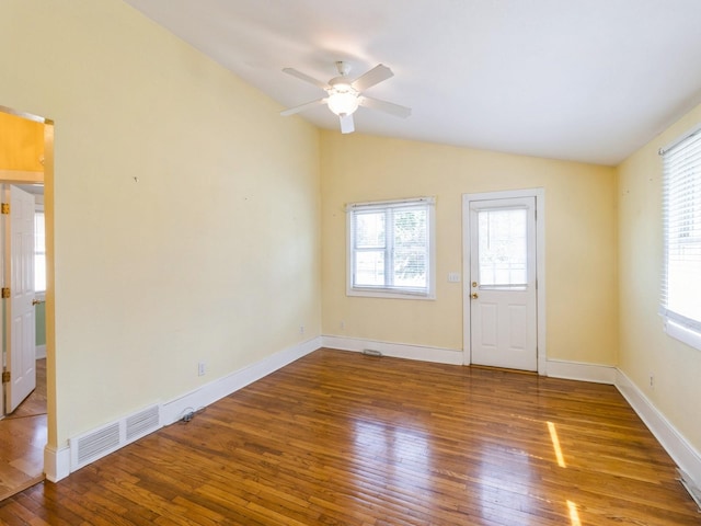 780 Iowa Ave, Martensdale, IA 50160 - unfurnished room with wood finished floors, lofted ceiling, and ceiling fan