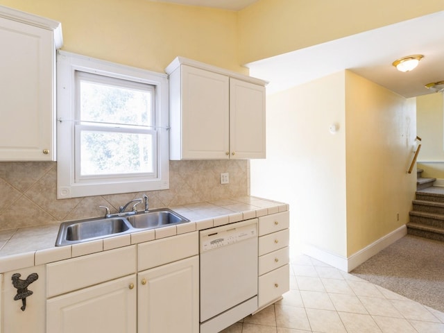 780 Iowa Ave, Martensdale, IA 50160 - kitchen featuring dishwasher, decorative backsplash, white cabinets, and tile countertops