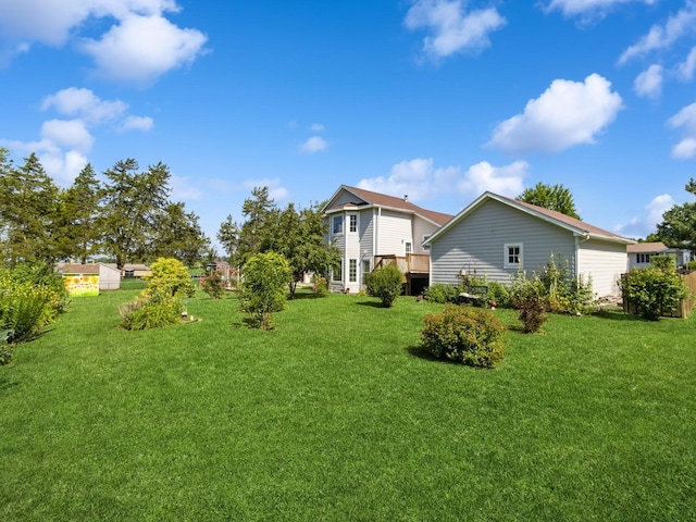 780 Iowa Ave, Martensdale, IA 50160 - view of grassy yard featuring a wooden deck