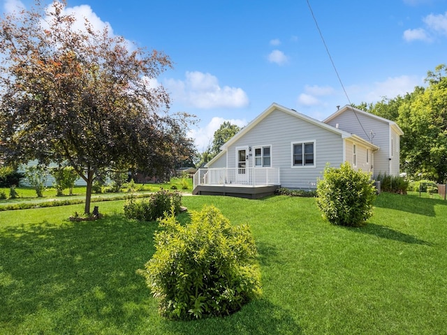 780 Iowa Ave, Martensdale, IA 50160 - back of property with a deck and a lawn