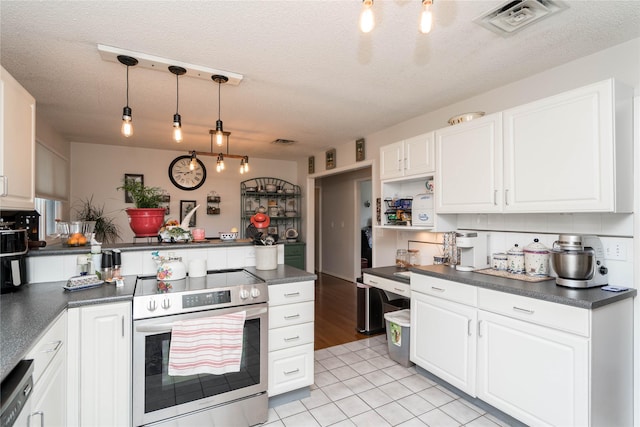 729 SE 3rd St, Ankeny, IA 50021 - kitchen featuring stainless steel electric stove, dark countertops, a peninsula, a textured ceiling, and white cabinets