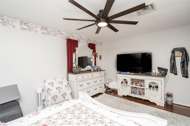 729 SE 3rd St, Ankeny, IA 50021 - bedroom featuring wood finished floors, a ceiling fan, and a textured ceiling