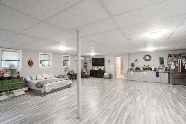 729 SE 3rd St, Ankeny, IA 50021 - living room featuring light wood-style floors and a paneled ceiling