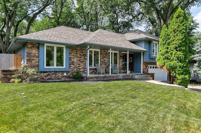 10438 Donna Bella Cir, Clive, IA 50325 - split level home featuring a shingled roof, covered porch, an attached garage, board and batten siding, and brick siding
