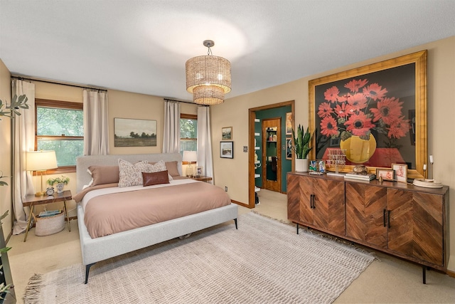 10438 Donna Bella Cir, Clive, IA 50325 - bedroom featuring light colored carpet and a chandelier