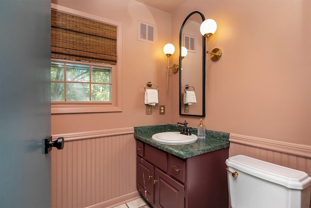 10438 Donna Bella Cir, Clive, IA 50325 - half bathroom featuring wainscoting and vanity