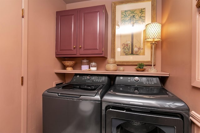 10438 Donna Bella Cir, Clive, IA 50325 - laundry room featuring washing machine and dryer and cabinet space