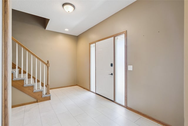 303 Trevor Ct, Norwalk, IA 50211 - entrance foyer with baseboards and stairs