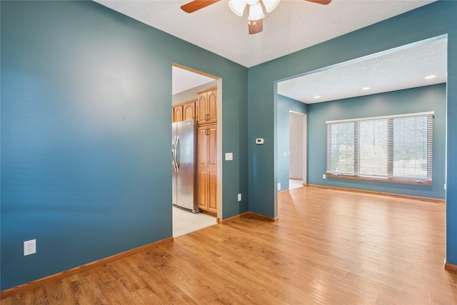 303 Trevor Ct, Norwalk, IA 50211 - spare room with a ceiling fan and light wood finished floors