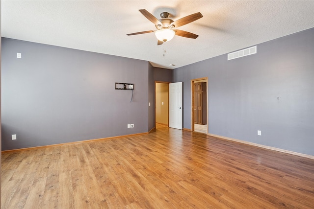 303 Trevor Ct, Norwalk, IA 50211 - unfurnished room featuring ceiling fan, light wood-style floors, and a textured ceiling