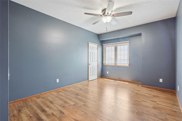303 Trevor Ct, Norwalk, IA 50211 - unfurnished room with a ceiling fan, a textured ceiling, and wood finished floors