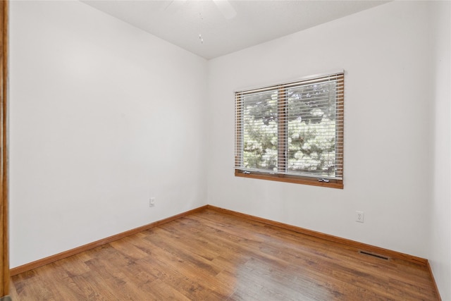 303 Trevor Ct, Norwalk, IA 50211 - unfurnished room with light wood-style floors and a ceiling fan