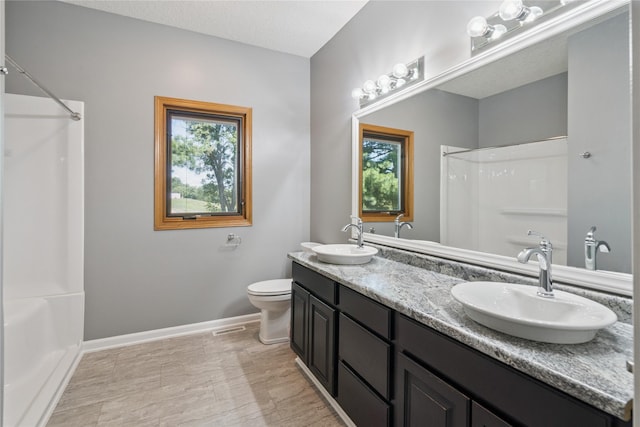 303 Trevor Ct, Norwalk, IA 50211 - bathroom featuring plenty of natural light, double vanity, and shower / tub combination