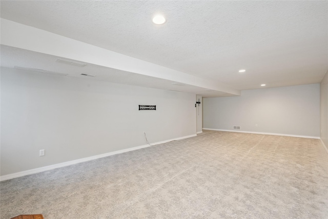 303 Trevor Ct, Norwalk, IA 50211 - finished basement with recessed lighting and light carpet