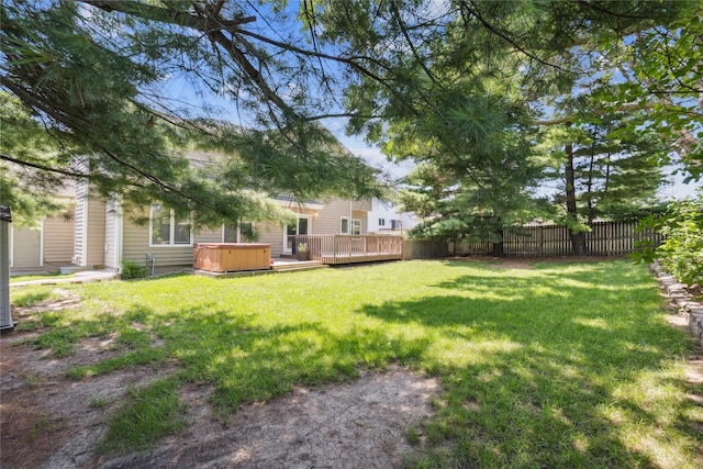 303 Trevor Ct, Norwalk, IA 50211 - view of yard with a hot tub and a wooden deck