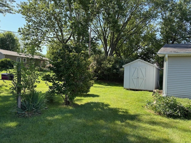 3909 75th St, Urbandale, IA 50322 - view of grassy yard featuring a storage shed