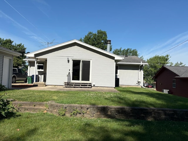 3909 75th St, Urbandale, IA 50322 - back of house with entry steps and a yard