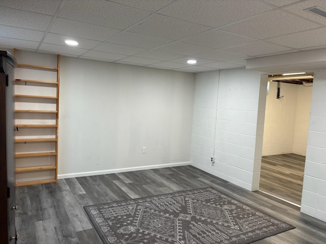 3909 75th St, Urbandale, IA 50322 - finished below grade area featuring wood finished floors, recessed lighting, concrete block wall, and a drop ceiling