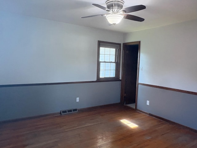 3909 75th St, Urbandale, IA 50322 - empty room featuring a ceiling fan and wood finished floors