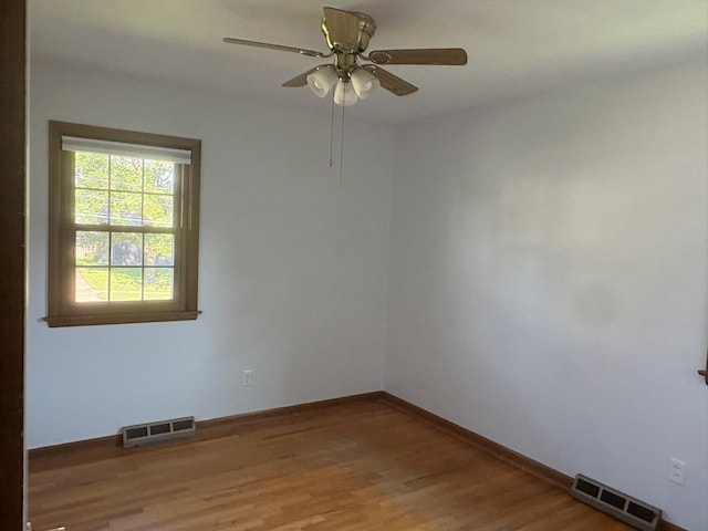 3909 75th St, Urbandale, IA 50322 - empty room featuring wood finished floors and a ceiling fan