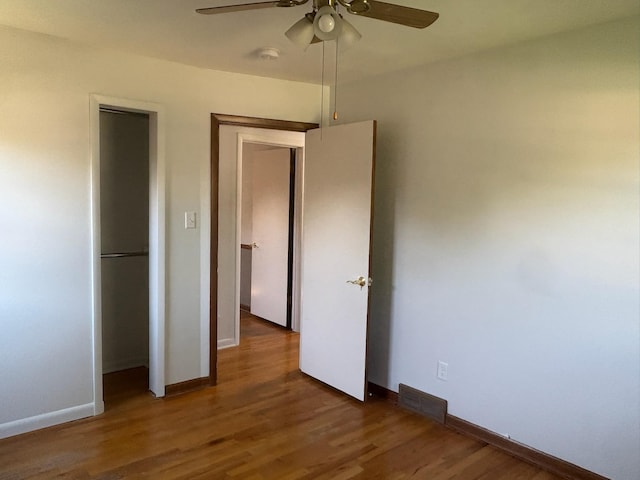 3909 75th St, Urbandale, IA 50322 - unfurnished bedroom with wood finished floors and ceiling fan