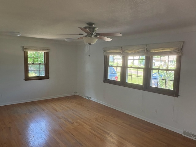 3909 75th St, Urbandale, IA 50322 - unfurnished room with wood finished floors and ceiling fan