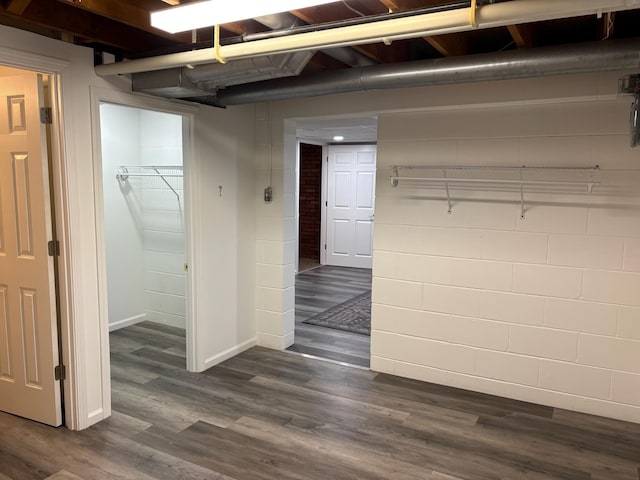 3909 75th St, Urbandale, IA 50322 - finished basement with dark wood-type flooring and baseboards