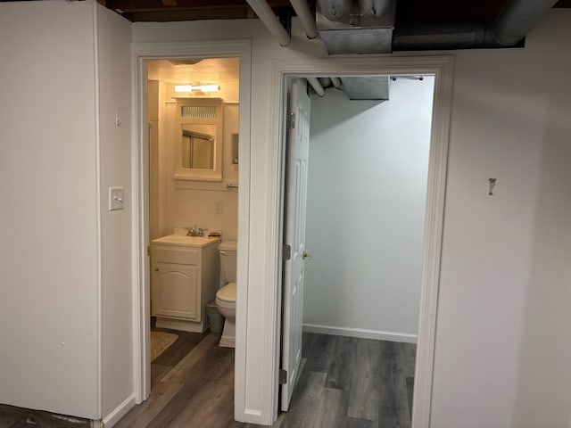 3909 75th St, Urbandale, IA 50322 - bathroom featuring wood finished floors and vanity