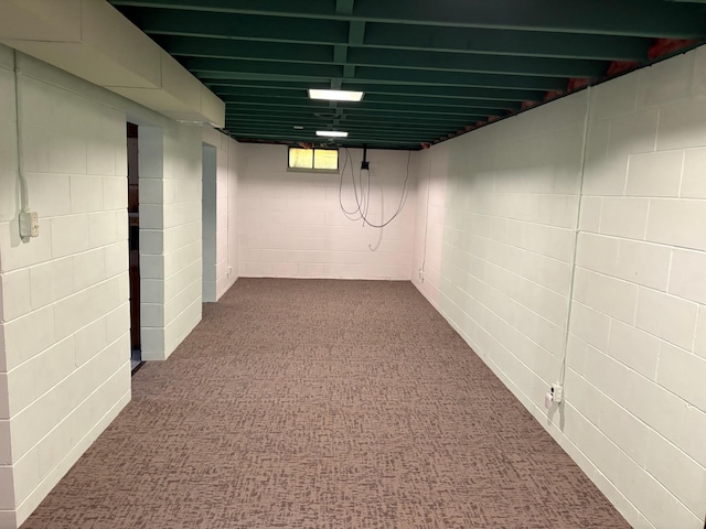 3909 75th St, Urbandale, IA 50322 - below grade area featuring dark carpet