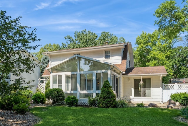 4511 67th St, Urbandale, IA 50322 - rear view of property with a sunroom