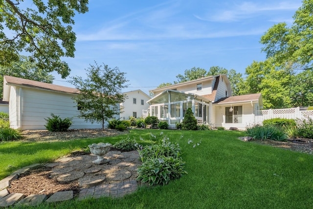 4511 67th St, Urbandale, IA 50322 - back of house with a sunroom