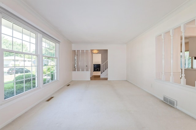 4511 67th St, Urbandale, IA 50322 - carpeted spare room with crown molding and stairway