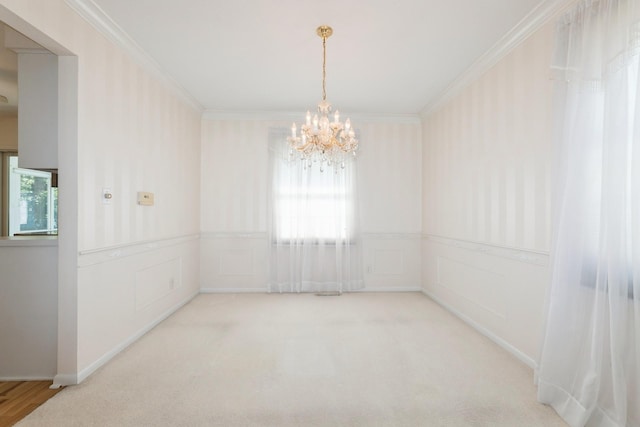 4511 67th St, Urbandale, IA 50322 - carpeted spare room featuring a chandelier, crown molding, and wainscoting