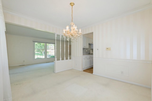 4511 67th St, Urbandale, IA 50322 - unfurnished room featuring light colored carpet, crown molding, a chandelier, and wallpapered walls