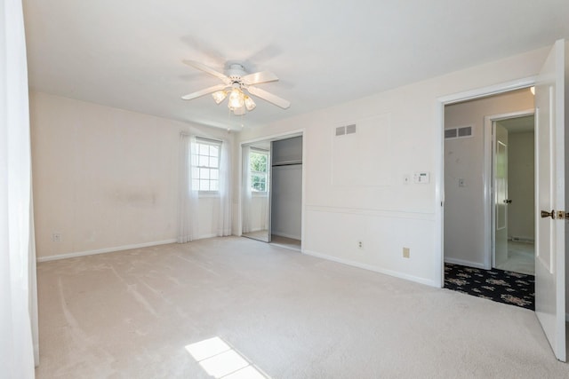 4511 67th St, Urbandale, IA 50322 - unfurnished bedroom featuring carpet floors, a closet, and a ceiling fan