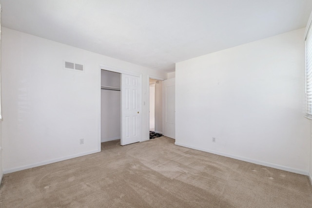 4511 67th St, Urbandale, IA 50322 - unfurnished bedroom featuring carpet floors and a closet