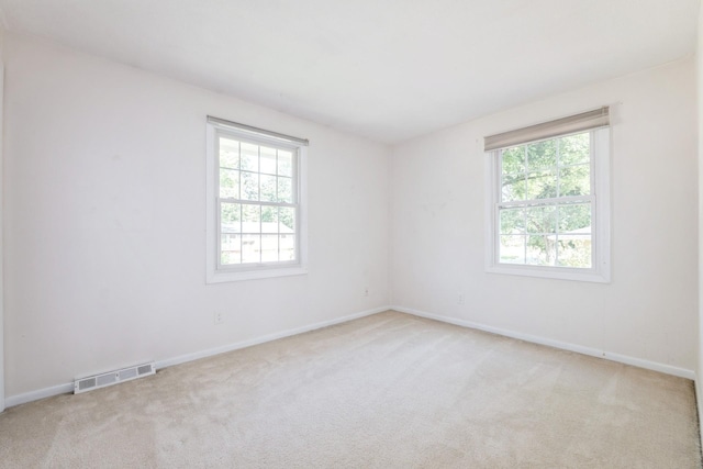 4511 67th St, Urbandale, IA 50322 - empty room with plenty of natural light and light carpet